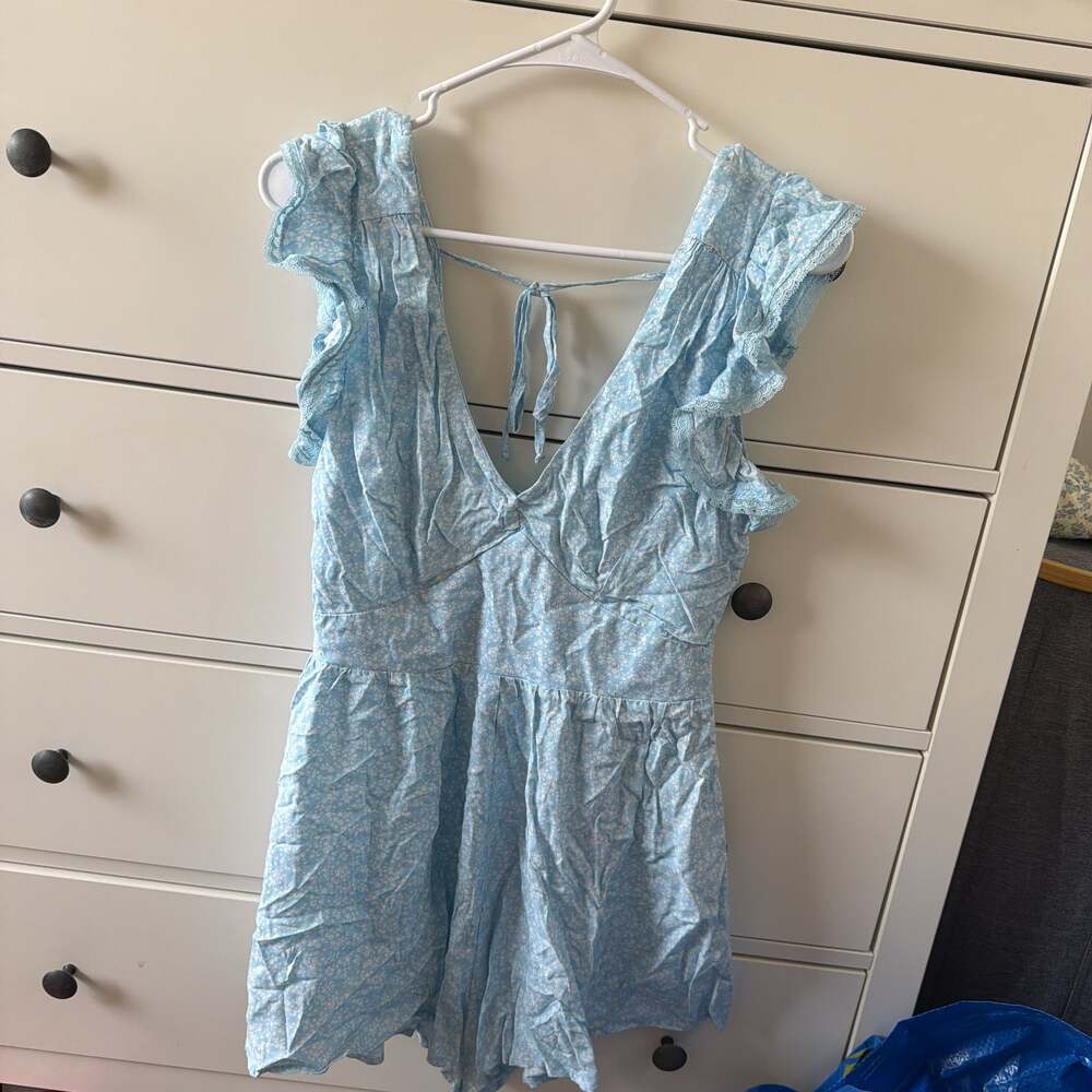 Francesca's Kadence Blue Floral Flutter Sleeve Ruffle Romper
